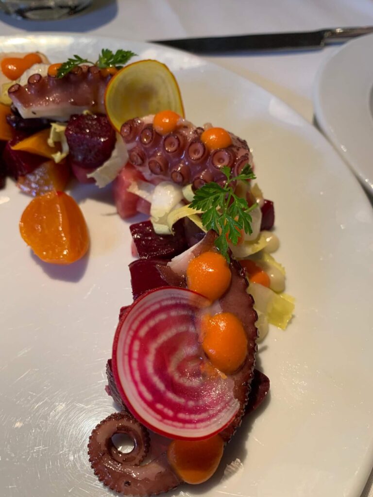 Araxi Restaurant & Oyster Bar grilled octopus and beets closeup view