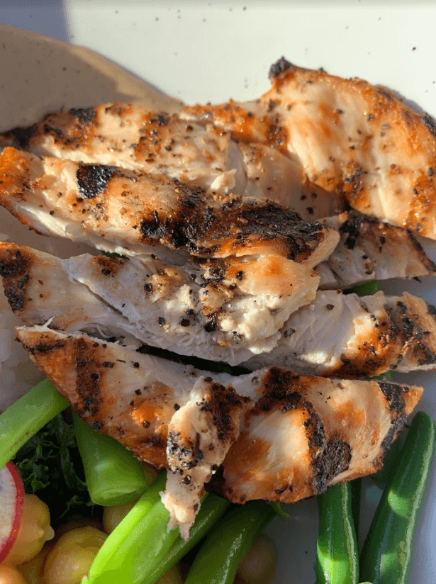 chicken breast on Cali bowl close up view