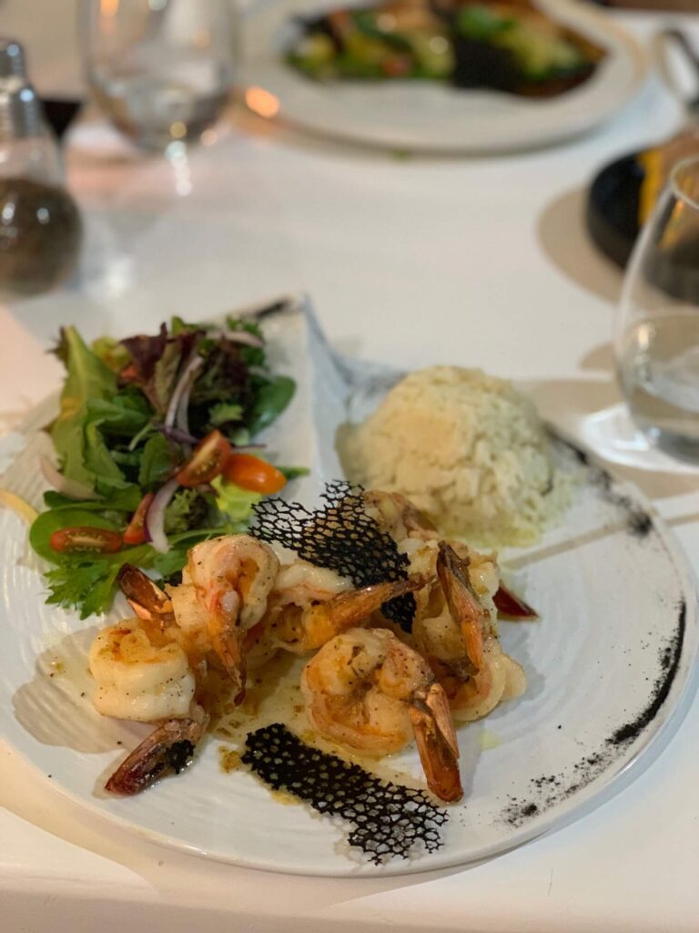 garlic shrimp with salad and rice