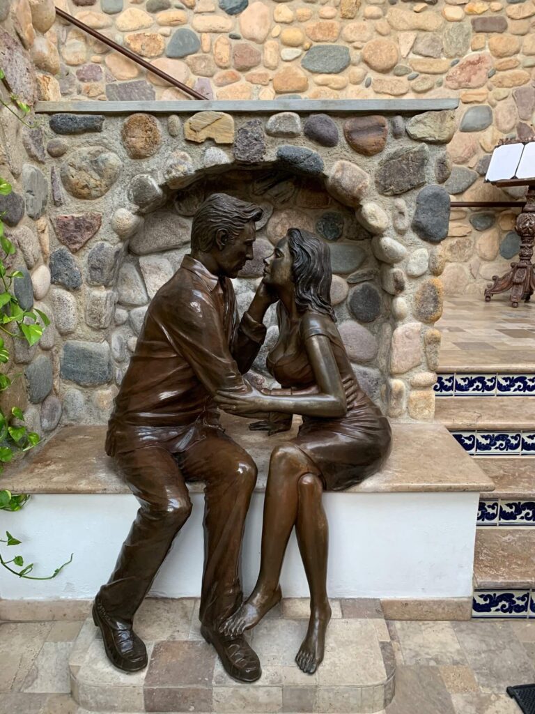 a man and woman statue at Iguana Restaurant Puerto Vallarta